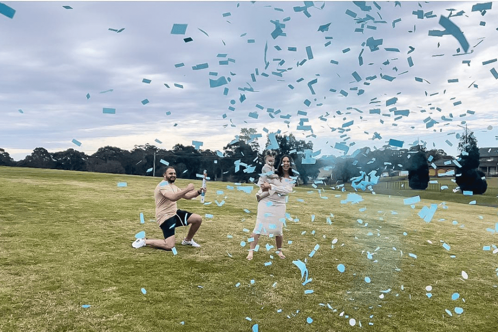 couple Gender reveal cannons smoke and confetti cannon in park