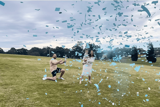 couple Gender reveal cannons smoke and confetti cannon in park